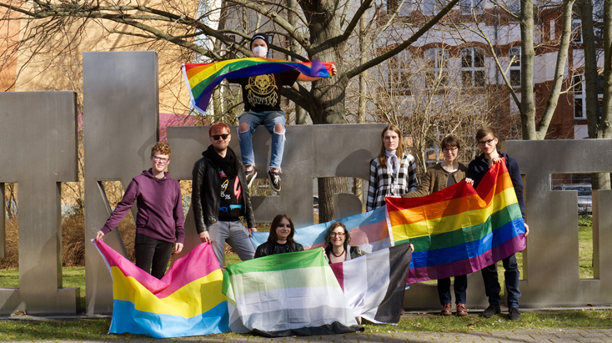 The team of the student initiative OVGUpride in front of the uniporta with rainbow flags (c) private The team of the student initiative OVGUpride in front of the uniporta with rainbow flags (c) private