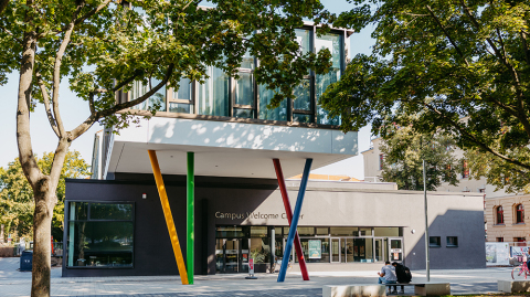 In front of the entrance to the Campus Welcome Centre with its colourful columns (c) Jana Dünnhaupt, University of Magdeburg In front of the entrance to the Campus Welcome Centre with its colourful columns (c) Jana Dünnhaupt, University of Magdeburg